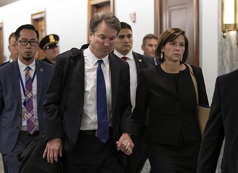 Supreme Court nominee Brett Kavanaugh and his wife Ashley Estes Kavanaugh depart after testifying before the Senate Judiciary Committee on Capitol Hill in Washington, Sept. 27, 2018. (Photo | AP)
