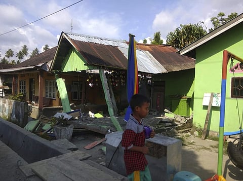 In this photo released by the Disaster Management Agency, a house sits damaged after a 6.2 magnitude earthquake hit Donggala, central Sulawesi, Indonesia, earlier in the day. (Photo | AP)