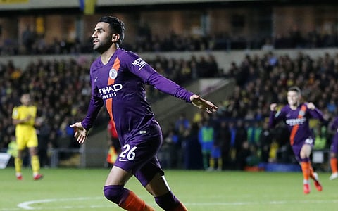 Manchester City's Riyad Mahrez celebrates after scoring his side's second goal during the English League Cup match against Oxford United at the Kassam Stadium in Oxford | AP