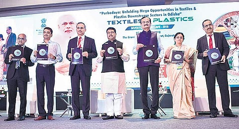Dharmendra Pradhan, Union Minister of Petroleum and Natural Gas, with Pradipsinh Jadeja, Gujarat’s Minister of State for Energy, Sanjiv Singh, Chairman, IOC, and others during the Textiles and Plastics Investors’ Conclave in Surat| Express