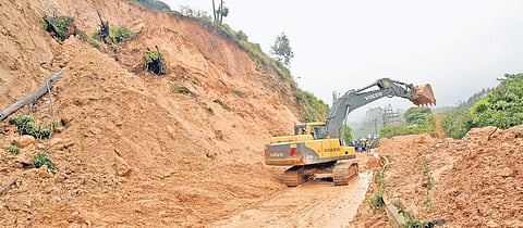 In view of the neelakurinji blooming season, the mud and boulders that fell on the Kochi-Dhanushkodi national highway at Munnar are being removed | Express file photo