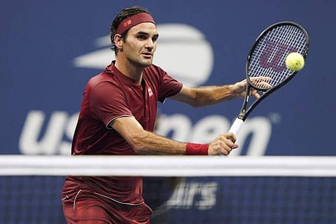 Switzerland's Roger Federer returns the ball to Australia's John Millman during their 2018 US Open Men's Singles tennis match at the USTA Billie Jean King National Tennis Center in New York. (Photo | AFP)