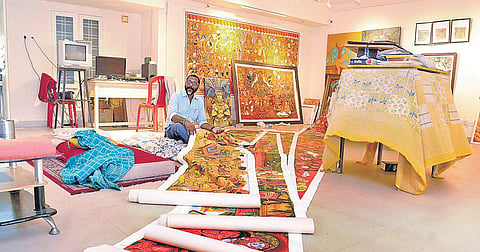 Shaju Thuruthil, Head of Fine Arts Department, Sree Sankaracharya University of Sanskrit, Kalady, in front of the paintings at his residence which was destroyed during the flooding of the Periyar river | A Sanesh