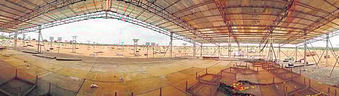 Workers cleaning the ground after Pragathi Nivedana meeting