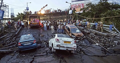 Kolkata Vehicles are seen stuck after a section of Majerhat bridge collapsed in Kolkata Tuesday September 04, 2018. | PTI