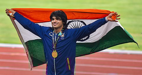 Gold medallist India's Neeraj Chopra poses for photographs at the medal ceremony of the men's javelin throw event during the 18th Asian Games 2018 in Jakarta Indonesia. (Photo | PTI)