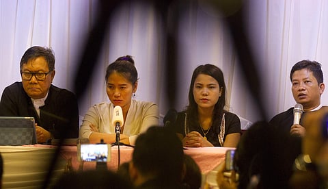 Than Zaw Aung, right, a lawyer of two Reuters journalists, talks to journalists during a press briefing together with Pan Ei Mon, second left, wife of Reuters journalist Wa Lone, Chit Su Win, second right, wife of Reuters journalist Kyaw Soe Oo, and Khin