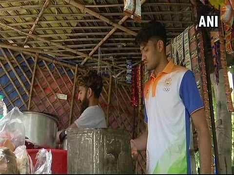 Harish Kumar, member of Indian Sepak Takraw team that won bronze medal at the Asian Games 2018, sells tea at his father's shop. (Photo | ANI)