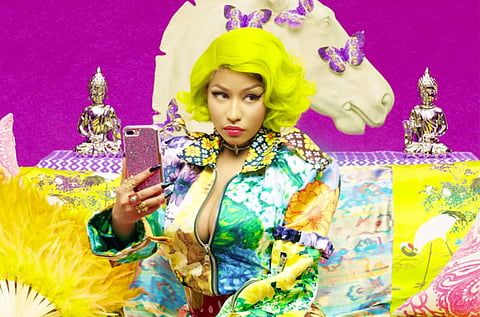 Minaj can be seen rapping from the three-minute and 13-second mark while wearing a multi-coloured neon outfit. (Photo: YouTube)