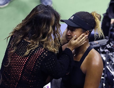Naomi Osaka, of Japan, is hugged by her mom, Tamaki Osaka, after defeating Serena Williams is the women's final of the U.S. Open tennis tournament, Saturday, Sept. 8, 2018, in New York. | AP