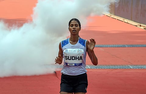 Asian Games medallist Sudha Singh crosses the finish line to win the Tata Mumbai Marathon in the Indian Women's category in Mumbai Sunday Jan 20 2019. (Photo | PTI)