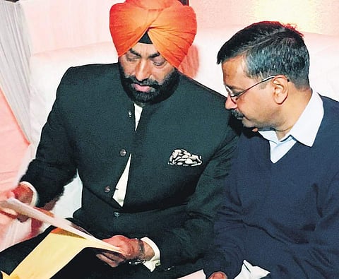 Sukhpal Singh Khaira and Arvind Kejriwal in happier times | Express