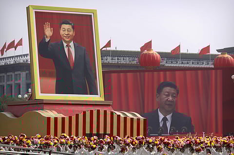 Participants cheer beneath a large portrait of Chinese President Xi Jinping during a parade to commemorate the 70th anniversary of the founding of Communist China in Beijing. ( Photo | AP )