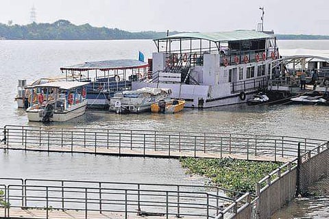 Boats stand stationed at Punnami Ghat in Vijayawada on Monday as boating was stopped in view of the heavy inflows | express