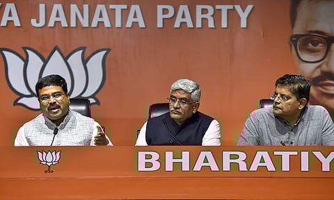Union ministers and BJP leaders Dharmendra Pradhan and Gajendra Singh Shekhawat with party leader Baijayant Panda address a press conference at the party office in New Delhi. (Photo | PTI)