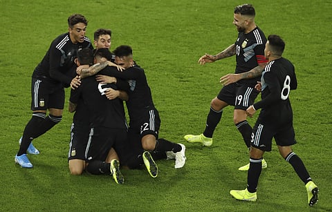 Argentina's players celebrate their tying goal in a friendly against Germany at Signal Iduna Park in Dortmund. (Photo | AP)