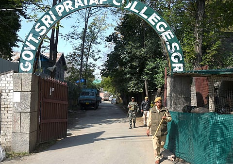 Security personnel stand guard outside the main gate of a college in Srinagar Wednesday Oct. 9 2019. | (File | PTI)