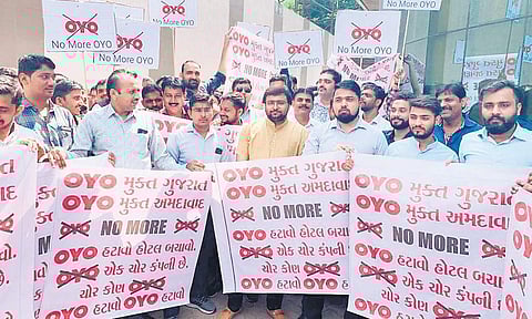 Hotel owners protest in Karnataka over OYO Room’s increase in fees| Express