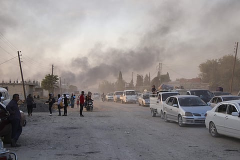 Syrians flee shelling by Turkish forces in Ras al Ayn, northeast Syria. (Photo|AP)