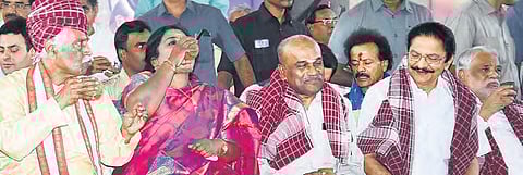 Himachal Pradesh Governor Bandaru Dattatreyaa and Telangana Governor Tamilisai Soundararajan drink ‘ambali’, during a cultural event organised to celebrate the ‘Alai Balai’ in Hyderabad on Thursday | RVK Rao