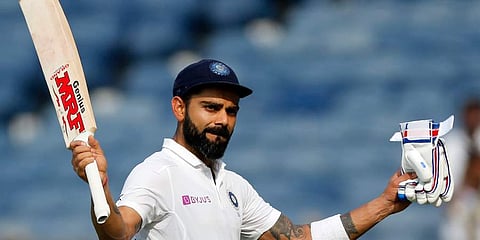 Virat Kohli acknowledges fans after India declared their innings during the second day of the second cricket test match between India and South Africa in Pune. (Photo | AP)