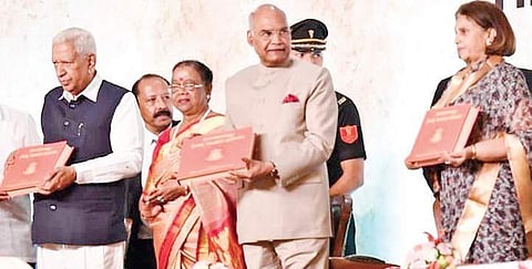 President Ram Nath Kovind releases a book at Mysuru Palace on Thursday. Governor Vajubhai Vala and Pramoda Devi Wadiyar are also seen | Express