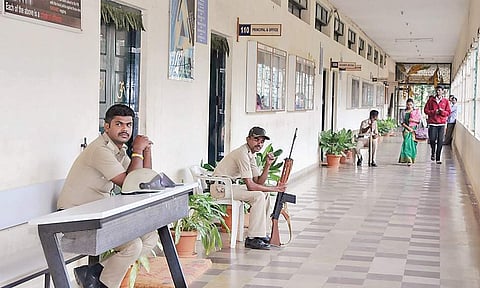 Armed police personnel guard one of the colleges owned by former Deputy Chief Minister G Parameshwara as IT officials search the premises | Express