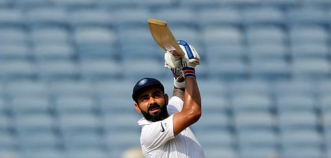 Virat Kohli bats during the second day of the second cricket test match between India and South Africa in Pune. (Photo | AP)