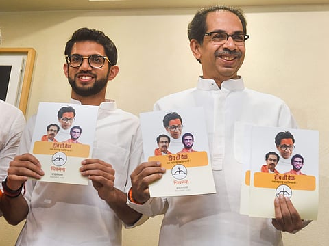 Shiv Sena President Uddhav Thackeray along with Yuva Sena chief Aditya Thackeray release the manifesto for assembly elections in Mumbai. (Photo | PTI)