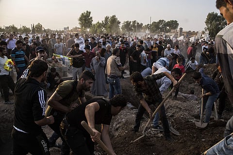 Syrians bury Syrian Democratic Forces fighters killed fighting Turkish advance in the Syrian town of Qamishli. (Photo| AP)