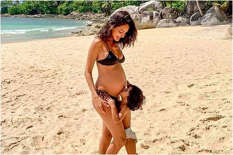 Lisa Haydon'sson kisses her baby bump. (Photo | Instagram)