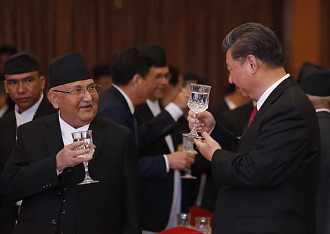 Chinese President Xi Jinping speaks with Nepalese Prime Minister Khadga Prasad Oli during a banquet at Soltee Hotel in Kathmandu, Nepal, Saturday, Oct. 12, 2019. (Photo | AP)
