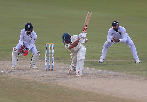 Indian cricketer Wriddhiman Saha takes a catch to dismiss South Africa's Theunis de Bruyn. (Photo | AP)
