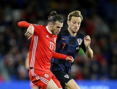 Wales' Gareth Bale (L) and Croatia's Ivan Rakitic battle for the ball during the UEFA Euro 2020 qualifying match. (Photo | AP)