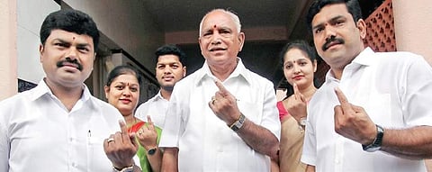 A file picture of Chief Minister B S Yeddyurappa with his sons B Y Raghavendra (left) and B Y Vijayendra (Photo | EPS)