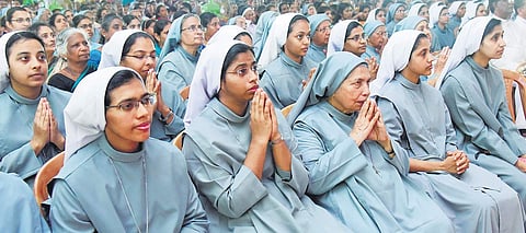 Nuns pray at Mariam Thresia pilgrim centre at Kuzhikkattussery on Sunday.