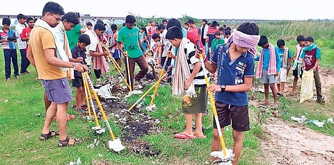 Children cleaning plastic waste at Kondaveeti Vagu Development Project (Photo |EPS)