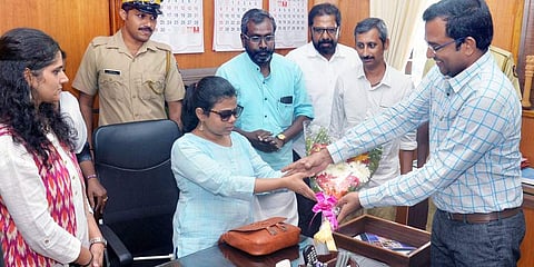 District collector K Gopalakrishnan welcoming the newly appointed sub-collector Pranjal Patil (Photo | Vincent Pulickal/ EPS)