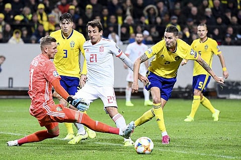 Sweden's goalkeeper Robin Olsen and Spain's midfielder Mikel Oyarzabal vie for the ball during the UEFA Euro 2020 Group F qualification football match. (Photo | AFP)