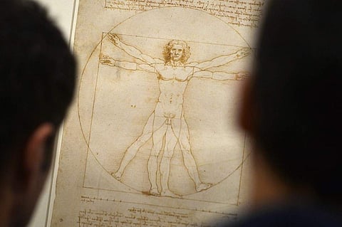 Visitors look at Leonardo da Vinci's 'Vitruvian Man' in Venice's Accademia Gallery (File photo| AFP)