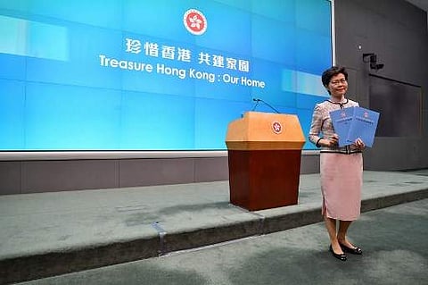 Hong Kong's Chief Executive Carrie Lam attends a press conference in Hong Kong on October 16, 2019, after she tried twice to begin her annual policy address inside the city's legislature. (Photo | AFP)