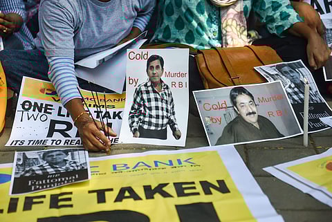 Depositors of the Punjab and Maharashtra Co-operative Bank PMC display placards during a protest over the Reserve Bank of India RBI 's curb on the bank outside Esplanade court in Mumbai Wednesday Oct. 16 2019. | (Photo | PTI)