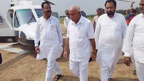 Chief Minister B S Yediyurappa, his deputy Laxman Savadi and other BJP leaders from Jatt segment, near Belagavi, on Wednesday. (Photo | Express)