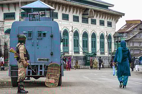 A security personnel stands guard during restrictions in Srinagar Friday Oct. 18 2019. | (Photo | PTI)