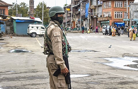 A security personnel stands guard during restrictions in Srinagar Friday Oct. 18 2019. | (Photo | PTI)