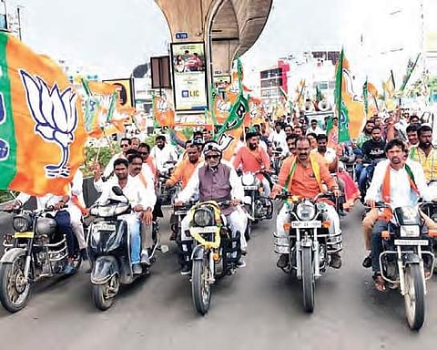 BJP State president K Laxman leads a bike rally in support of the RTC unions’ strike at Kukatpally in Hyderabad on Friday