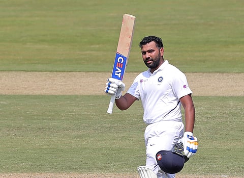 India's Rohit Sharma raises his bat after scoring a hundred. (Photo | AP)