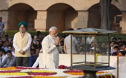 Prime minister Narendra modi pays tribute to Mahatma Gandhi on his 150th birth Anniversary at Rajghat in New Delhi on Wednesday. | (Photo | Shekhar Yadav/EPS)