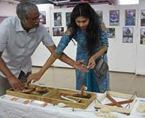 Visitors explores different photographs of Mahatma Gandhi at Culture Centre of Vijayawada and Amaravati (Photo |EPS)