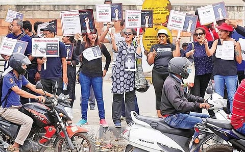 On Friday, Mahadevapura residents staged a protest at the Marathahalli Bridge demanding that elected representatives provide better amentities | Pandarinath B